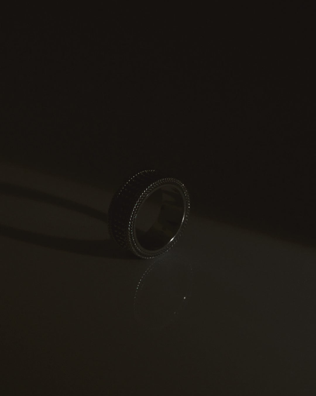 chunky silver ring revealed gradually with light