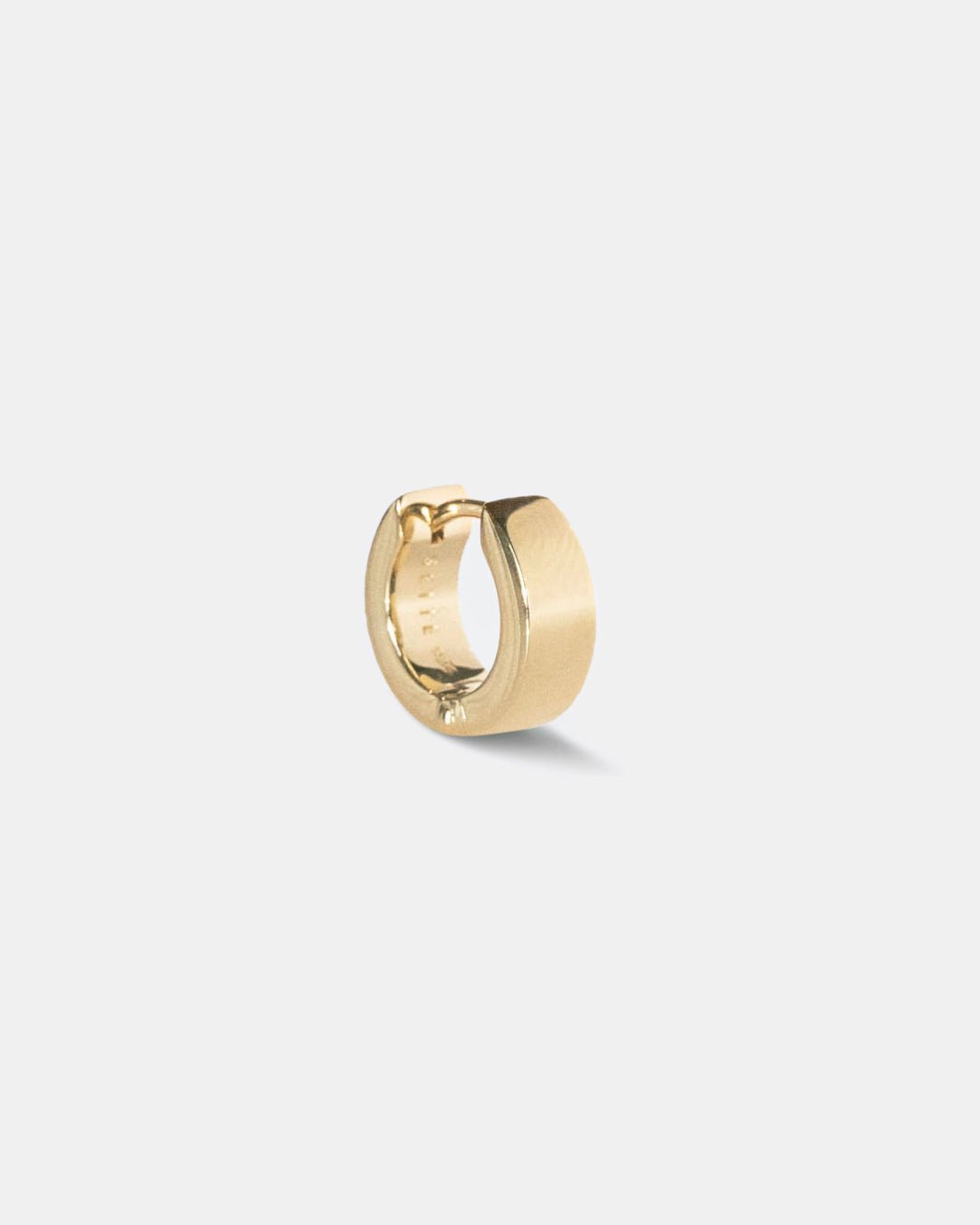 small gold hoop earring 18kt on white background by studio sette