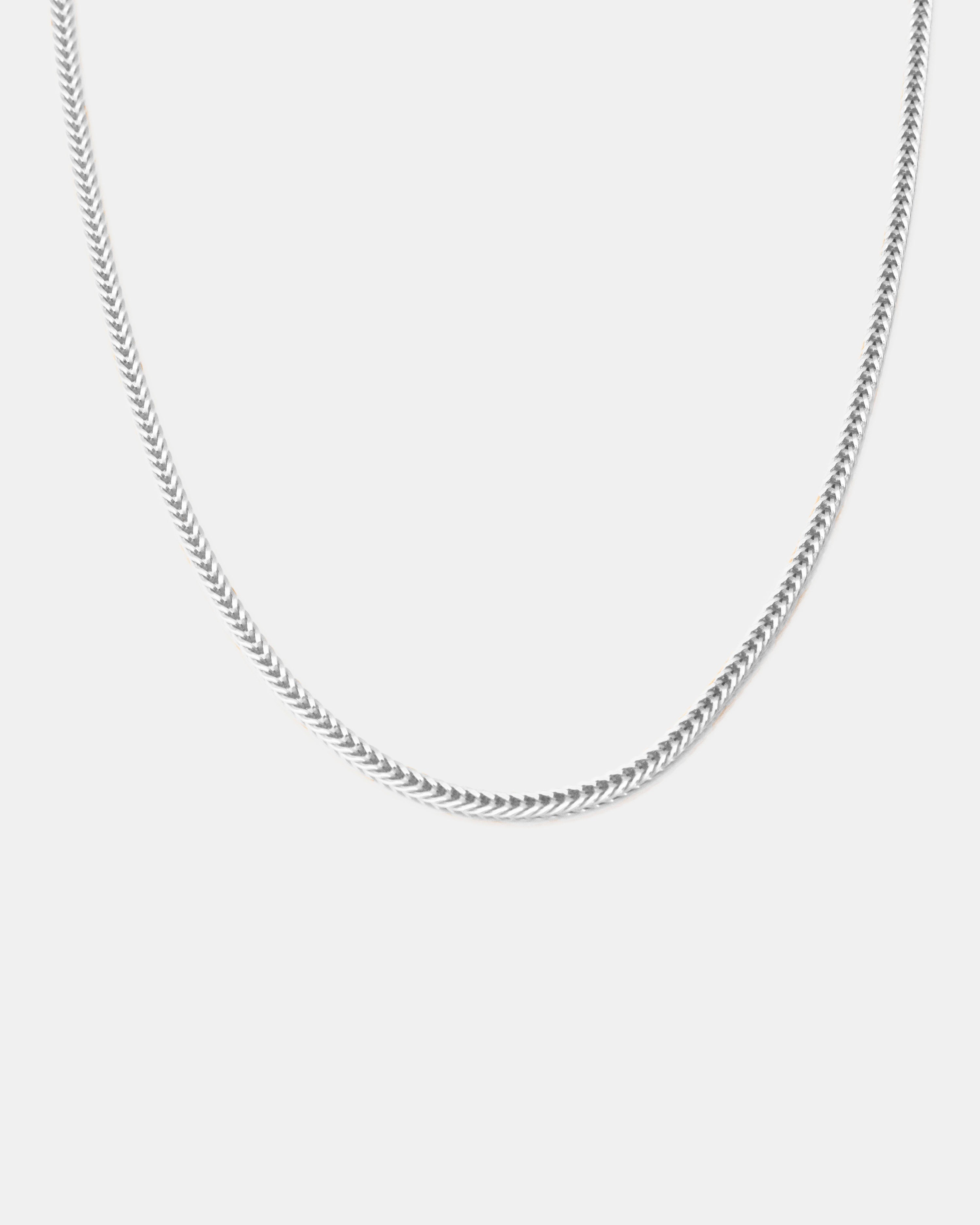 silver fox chain displayed on white background by studio sette