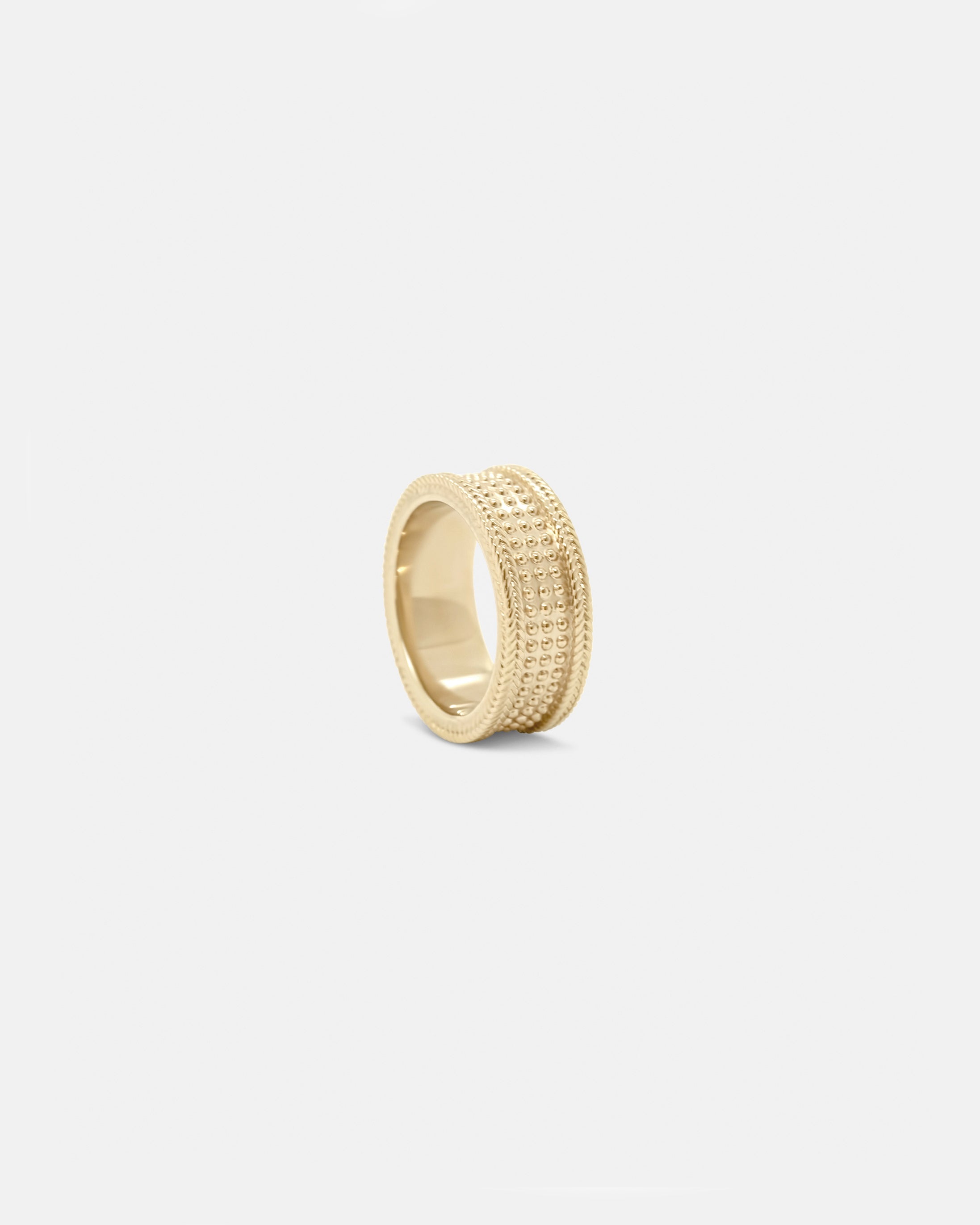A gold ring unisex with a polished finish, displayed against a white background by studio sette