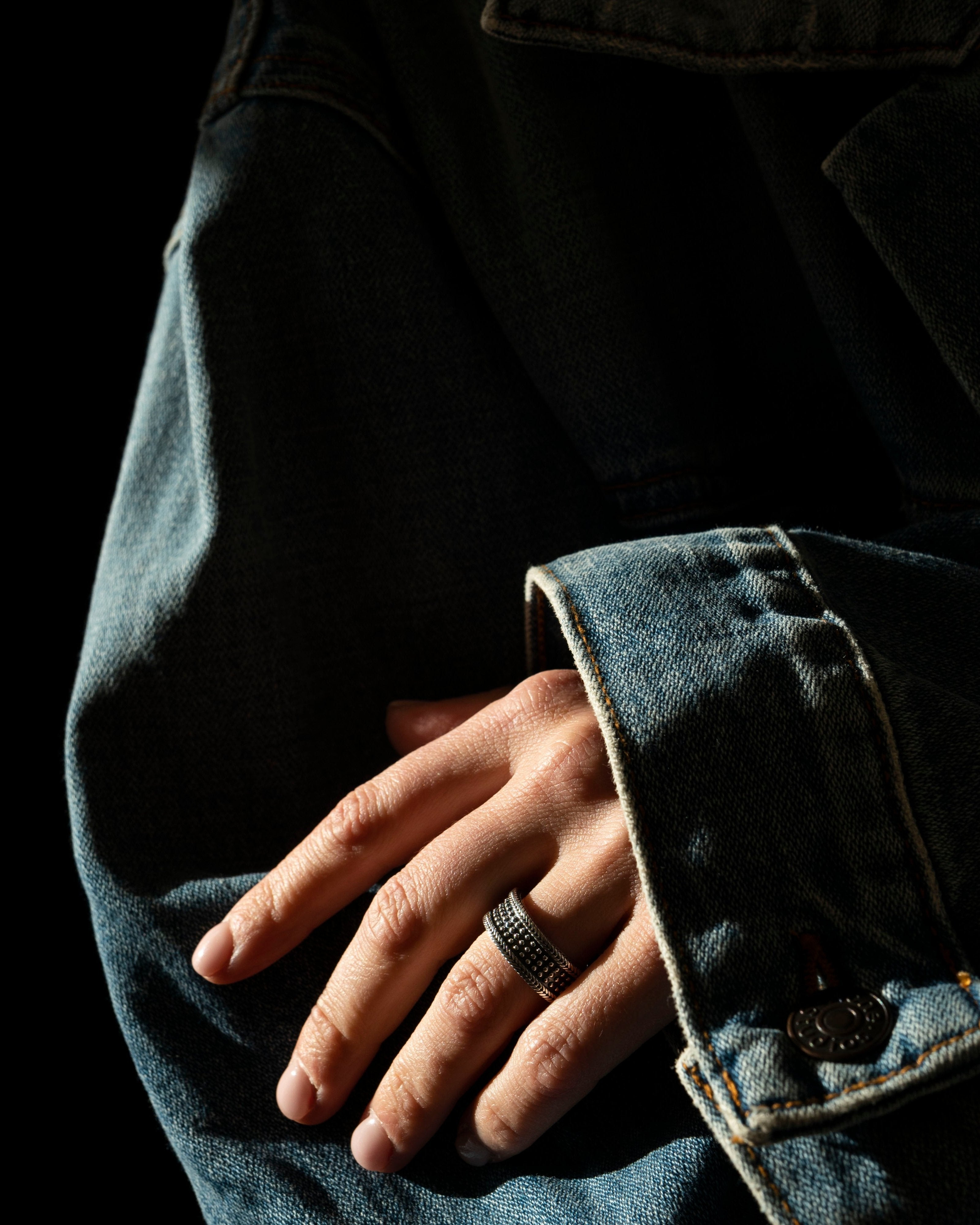 unisex Ring Silver on model ring fingers resting on arm of denim jacket
