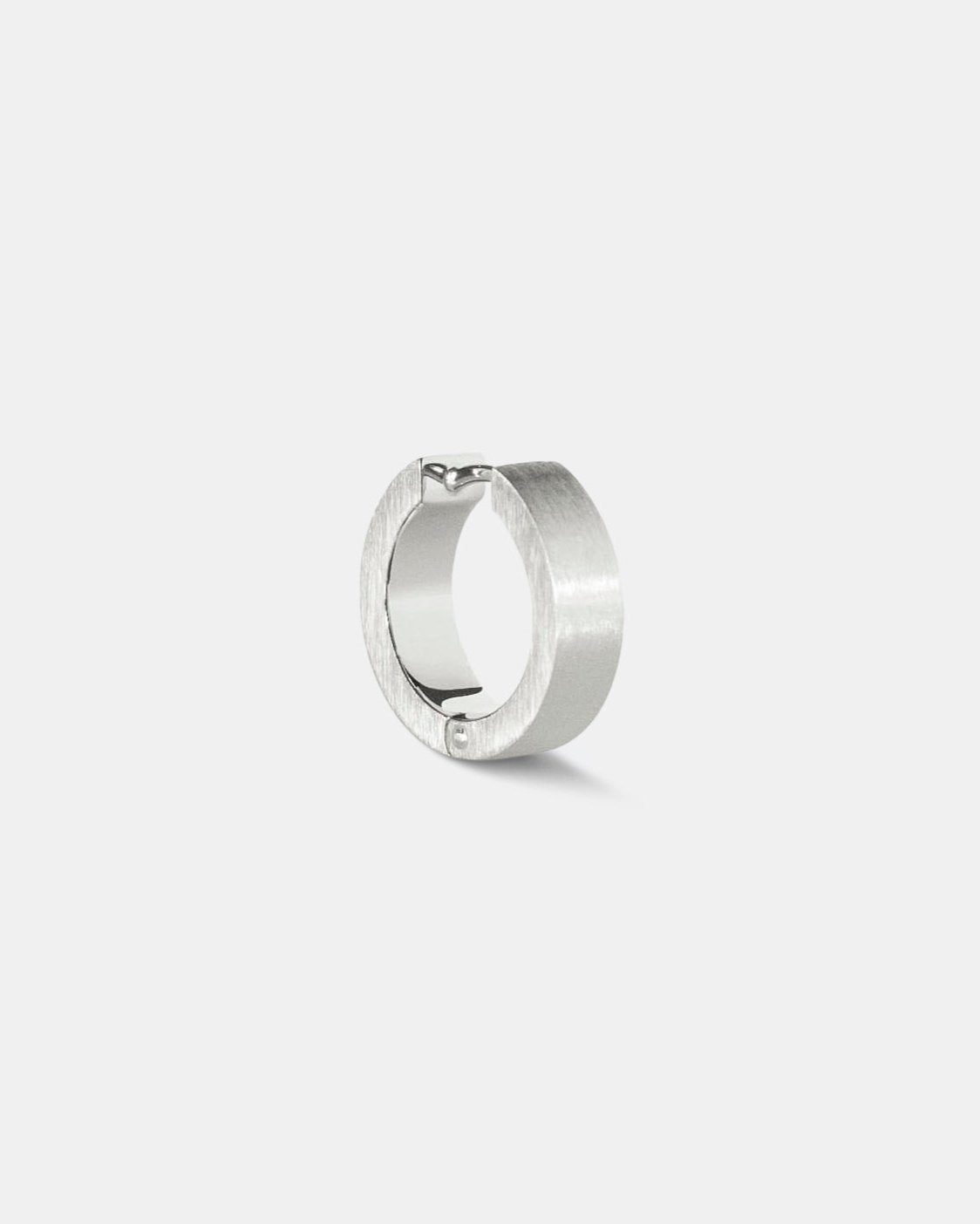 unisex silver hoop earrings brutalist design on white background by studio sette